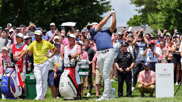Rory McIlroy tees off at the 2023 Travelers Championship.